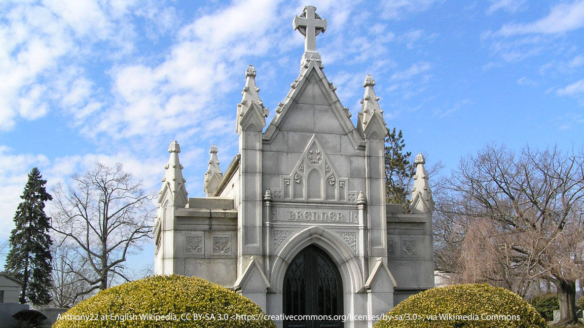 Large stone Brenner Mausoleum surrounded by landscaped grounds at Gate of Heaven Cemetery